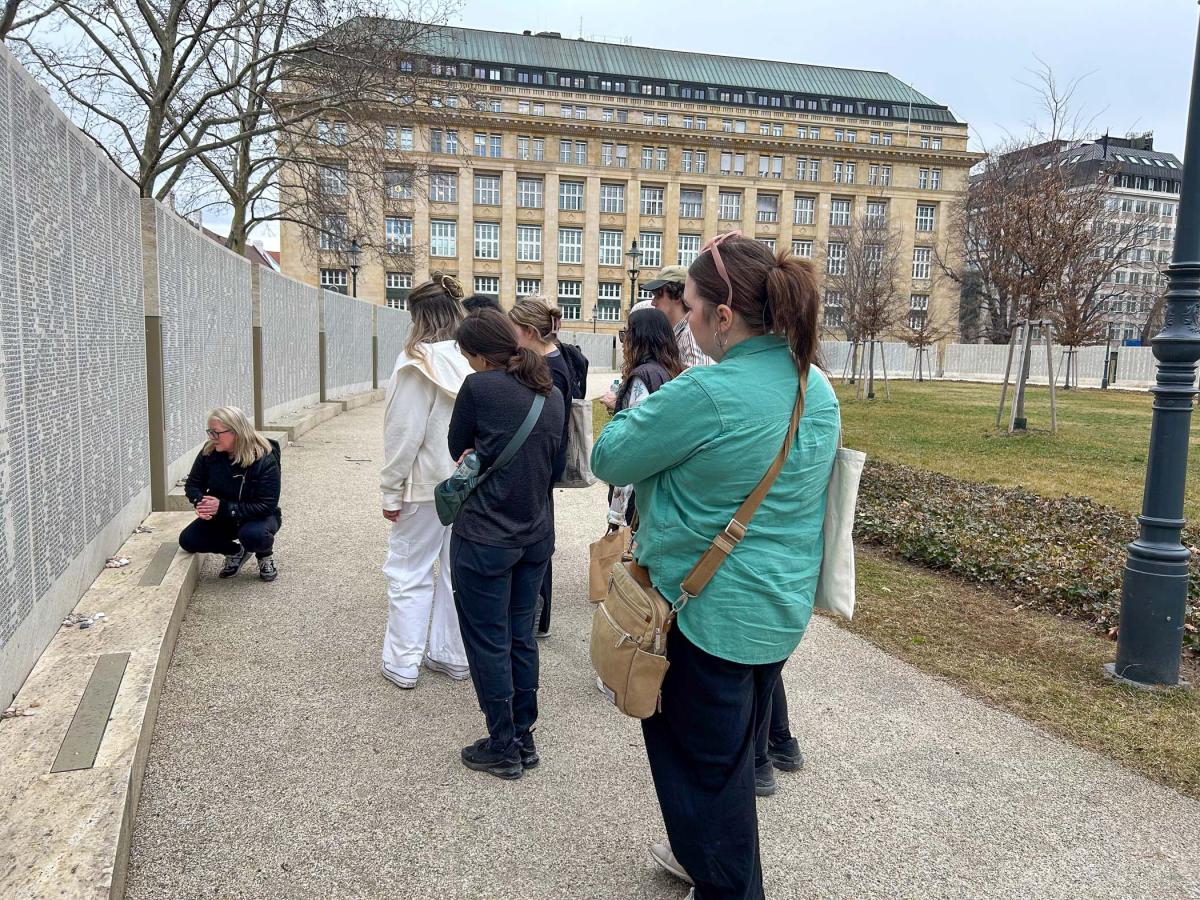 Students observe Vienna's Shoah Wall of Names