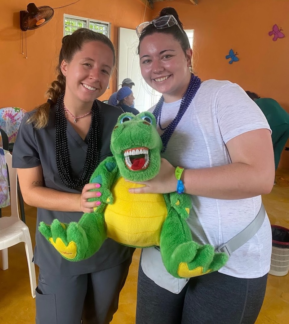 dental hygiene students take a break to pose for a picture in the DR