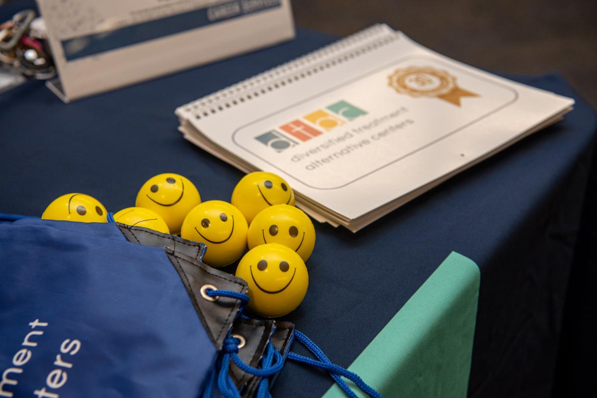 Shiny, happy “stress balls” adorn the table of Diversified Treatment Alternative Centers.