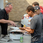 Brett A. Reasner, assistant dean of transportation technology, serves students.