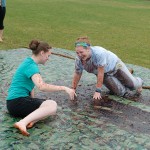 Undeterred by Mother Nature's whim, Traci L. Banfield, of Sayre (left), and Danielle M. Shreiner, of Lititz, surrender to the slop.