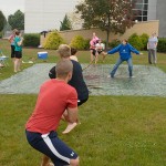 Club adviser Jeanne M. Kerschner, OTA clinical director, signals the start of competition between her students and a rival team from elsewhere in the School of Health Sciences.