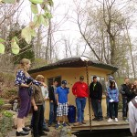 During a tour of her property, Margot Taylor (left) points out a water feature adjacent to a straw-bale garden structure with a "green" roof.