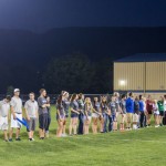 Fall athletes gather at midfield for halftime introductions.