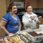 Culinary arts technology students Sarah Anne E. Haines (left) and Maria K. Maneval take part in decorating sweets