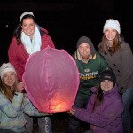 Emma J. Sutterlin (kneeling at right), of State College, this year's campus THON chair, joins some of her board members in preparing to set free one of the evening's final lanterns. From left are Kelsey A. Maneval, of McAlisterville; Lillian L. "Lily" Pakradooni, of Shillington; John D. Pater, of York; and Brieona R. Broadwater, of Berlin. Absent from the photo are board members Chelsea M. Burger, of Millersburg, and Allison D. Bailey, of West Chester.