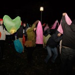 Participants battle frigid temperatures and occasional wind in trying to keep their lanterns lighted and under control.
