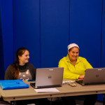 Working race check-in are Daniele A. Hebert (left), of Mechanicsburg, enrolled in pre-surgical technology, and April M. Tucker, an applied human services student from Muncy.