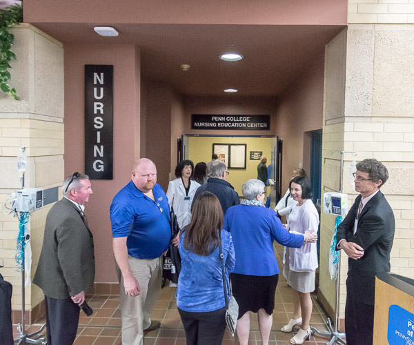 Sandra L. Richmond (in white coat on right), director of nursing, welcomes guests to tour the center.