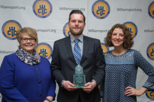 Penn College alumnus John R. Yogodzinski (’07, graphic communications management) is joined by Debra M. Miller, vice president for institutional advancement (left), and Kimberly R. Cassel, director of alumni relations, at the Williamsport/Lycoming Chamber of Commerce Education Celebration.