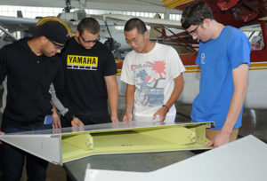 Students look over part of the Airbus donation in the Aviation Center hangar.