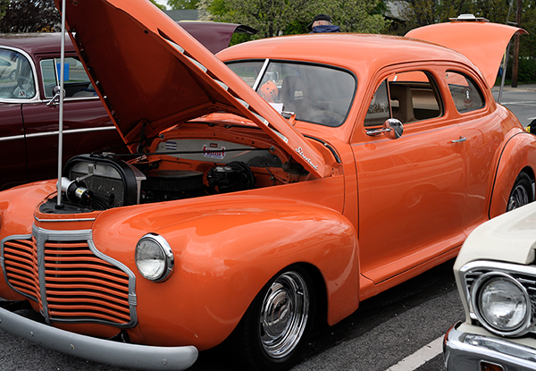 A brilliant orange 1941 Chevrolet Special Deluxe, with fuzzy dice to match!