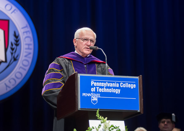 State Sen. Gene Yaw, chairman of the Penn College Board of Directors, congratulates Friday's graduates.