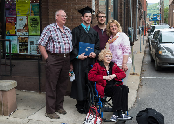 It's a family celebration for Clark W. Fuller, of Springville, who graduated in engineering design technology, in company that includes grandmother Lucille.