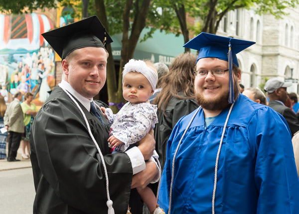 Engineering design technology major Logan J. Baxter (left), of Laurel, Del., marks the day with his daughter and his roommate, Nathan J. Wolfe, an electromechanical maintenance technology student from Glen Lyon.