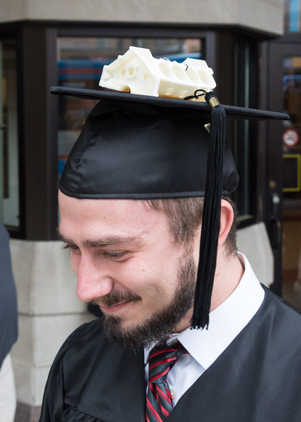 Michael B. McMullen, a manufacturing engineering technology major from Altoona, tops his cap with an engine block created in the 3-D printing lab.