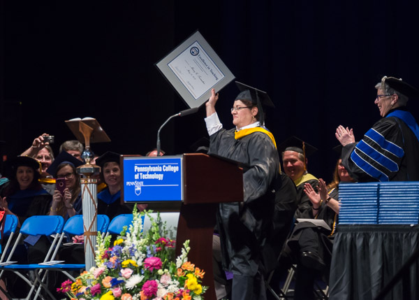 One of the weekend's two Excellence in Teaching honorees, Mary G. Trometter proudly displays her award.