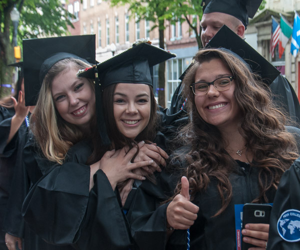 Nursing students huddle for a pre-commencement photo op.