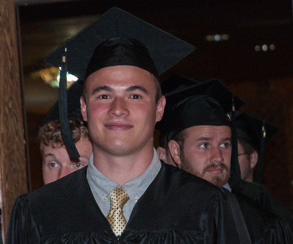 A grad soaks in the moment – a medley of popular tunes and a Community Arts Center lobby filled with fans waiting to see the grads exit.