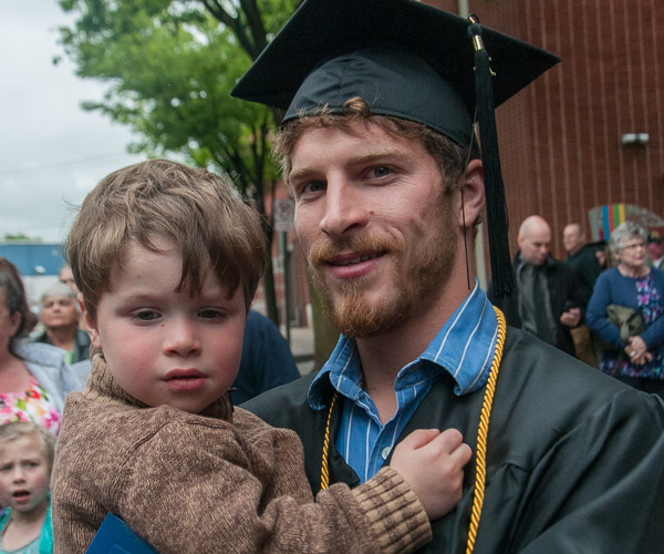 New civil engineering technology grad Marshall I. Cook, of Muncy Valley, celebrates with his son.