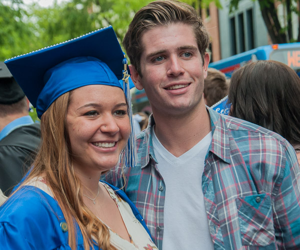 Health information technology graduate Ellenee J. Clymer-Barrett, of Jersey Shore, poses for a family photo.