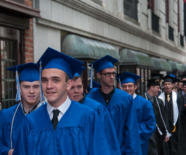 A long line of graduates from the School of Transportation and Natural Resources Technologies makes up the last group to process.