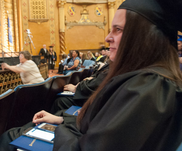 Through technology employed for the first time at a Penn College commencement, Morgan E. Blackwell an accounting grad from Beech Creek and co-recipient of the Board of Directors' Award, has closed captioning for the live event delivered to her phone. Wi-Fi hotspots were installed in the Community Arts Center to smooth the process, which delivered the commencement activities to an off-site stenographer, who typed the words as they were spoken.