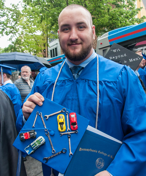 Zachary D. Warren, a graduate of automotive technology: Mopar CAP emphasis, shows his creative cap. Warren is from Hummelstown.