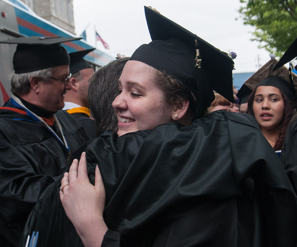 Katlyn J. Hackling, a culinary arts and systems graduate from Wilmington, Del., shares a hug with Chef Craig A. Cian, associate professor of hospitality management/culinary arts.