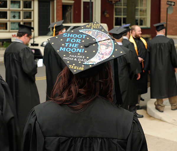 Graduating in welding and fabrication engineering technology, Tahlor L. Heath offers a silent shout-out to her supportive parents.