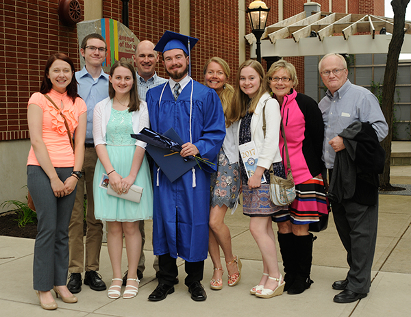 Welding technology major Andrew W. Klepper celebrates with supporters – including grandmother Joan M. Gilbert (second from right), who retired from front-line familiarity as a clerk in The College Store, and mother Susan L. (center), who, as a mass communications graduate, appeared on the cover of the Summer 1992 issue of the college magazine.