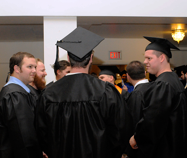 Jamison P. Deal (left), had ample reason to celebrate Friday: Earning a bachelor's degree in welding and fabrication engineering technology, accepting the Penn College Welding Faculty Award AND observing his 22nd birthday (which included a greeting card from the registrar's staff with his check-in material).