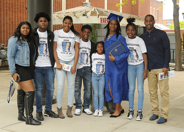 Custom-made T-shirts add an especially personal touch to an already memorable day for human services graduate Chanelle C. Johnson. 