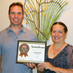 Michael R. Triassi, Le Jeune Chef’s director of sales and restaurant operations, receives a silver Reader’s Choice Award from Becky Fitzwater, an advertising representative for the Milton Standard-Journal.