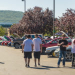 Cool cars offset unseasonable heat on a campus parking lot.