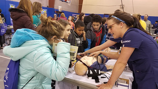 With the help of a student nurse, a young visitor gets a heartfelt earful.