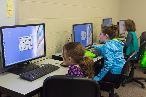 Girl Scouts monitor their creative process.