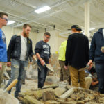 Penn College students (at left) Wyatt R. Ford, of Oreland, and Hunter M. Landis, of Middletown, mentor visitors to their assigned workstation.