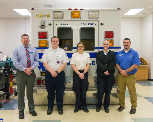 Paramedic Director Chris Boyer (left) and Brady L. Breon (right), assistant professor of paramedic, stand ready in the program’s well-equipped lab with students James A. Babinetz, of Doylestown; Gabrielle E. Hileman, of Hughesville; and Andee M. Lauritsen, of West Chester.