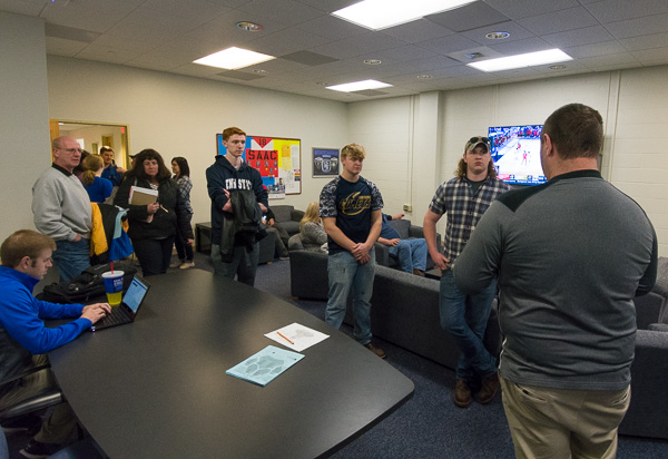 Prospective student-athletes learn about the college’s NCAA Division III sports programs in the Athletics Office.