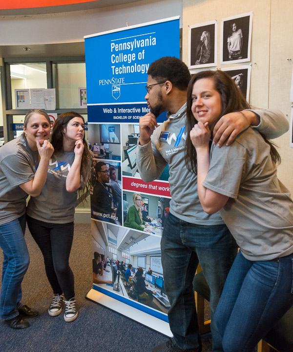 Web and interactive media students Cindy L. English, of Montoursville, Molly A. Amato, of Levittown, Malachi J. Atkinson, of Macungie, and Elisha R. Arantowicz, of Birdsboro, pose in new matching T-shirts that promote their major. 