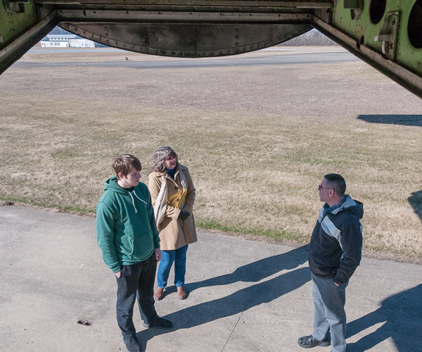 Behind the tail of the college’s Boeing 727, Bill Stepp III talks with a prospective student about the college’s aviation majors.