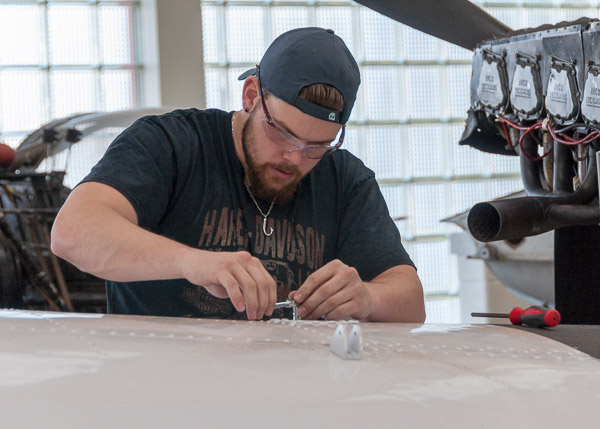 For his senior project, Korey T. Keyser, an aviation maintenance technology student from Waldorf, Md., is finishing body work on one of the Aviation Center’s fleet. During Open House, he assembled the wing fuel cell.