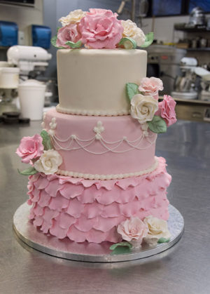 A wedding cake by Penn College student Jacqueline R. Dull, of Mohnton, received the top prize in the Student Tiered Wedding Cake category at the 2018 Atlantic Bakery Expo at the Atlantic City Convention Center.