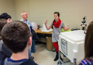 Plastics and polymer engineering technology student Sapphire E. Naugle, who earned 18 Penn College credits while a student at Jersey Shore Area High School, leads a group of Central Mountain High School Penn College NOW students and others through the college’s rotational molding lab.