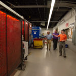 Bradley M. Webb (in hat), assistant dean of industrial, computing and engineering technologies, takes the legislative guests through the college's welding lab.