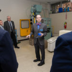 Bradley M. Webb, assistant dean of industrial, computing and engineering technologies, offers insights in the blow molding plastics lab. 