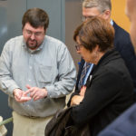 In the extrusion lab, Adam C. Barilla, instructor of plastics technology, engages guests in exploration of materials. Barilla is an alumnus of the plastics and polymer engineering technology major.