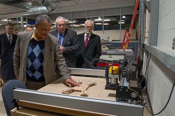 ... and are led by Tom F. Gregory (second from right), associate vice president for instruction, on a tour of the Dr. Welch Workshop: A Makerspace at Penn College.