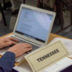 A delegate from The Volunteer State quickly researches a point brought forth by another delegate.